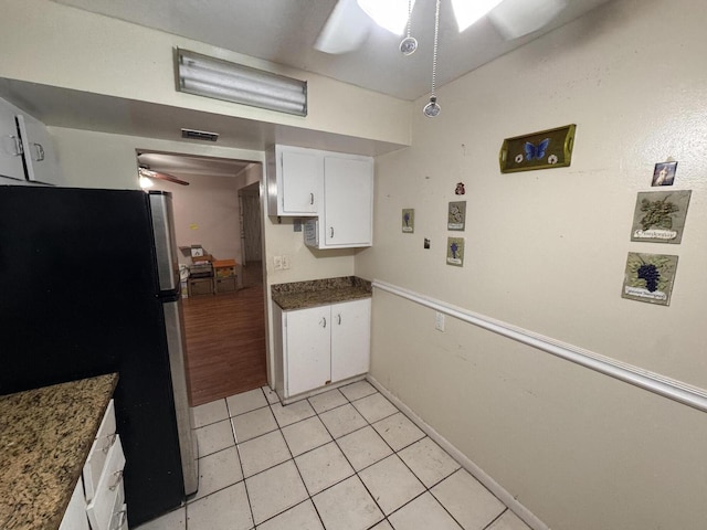 1400 Saint Charles Pl Unit 317, Pembroke Pines, FL 33026 - kitchen with freestanding refrigerator, ceiling fan, white cabinets, light tile patterned flooring, and baseboards