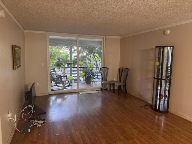 1400 Saint Charles Pl Unit 317, Pembroke Pines, FL 33026 - sitting room with a textured ceiling, crown molding, wood finished floors, and baseboards