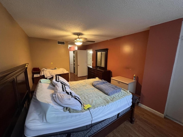 1400 Saint Charles Pl Unit 317, Pembroke Pines, FL 33026 - bedroom featuring a textured ceiling, wood finished floors, a ceiling fan, and baseboards
