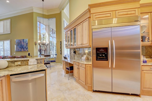 kitchen with crown molding, appliances with stainless steel finishes, decorative backsplash, and glass insert cabinets