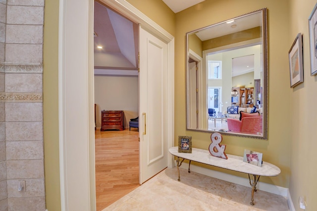 corridor featuring wood finished floors