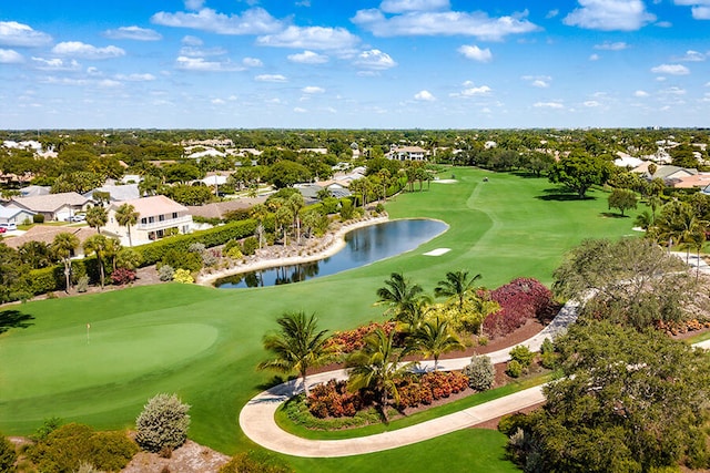 view of home's community with a water view, golf course view, and a residential view
