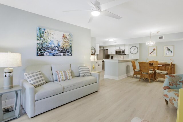 254 Village Blvd Unit 4207, Tequesta, FL 33469 - living room featuring light wood-style floors and a ceiling fan