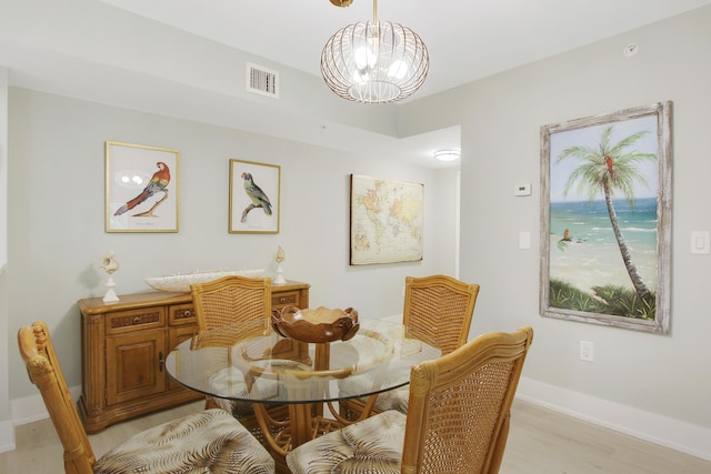 254 Village Blvd Unit 4207, Tequesta, FL 33469 - dining area with light wood-style flooring, a chandelier, and baseboards