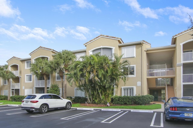 254 Village Blvd Unit 4207, Tequesta, FL 33469 - view of property with uncovered parking