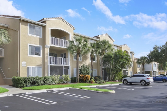 254 Village Blvd Unit 4207, Tequesta, FL 33469 - view of building exterior featuring uncovered parking