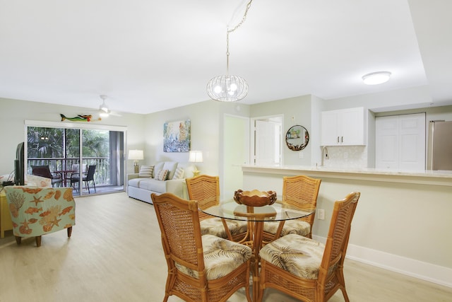 254 Village Blvd Unit 4207, Tequesta, FL 33469 - dining area with light wood finished floors, baseboards, and a chandelier