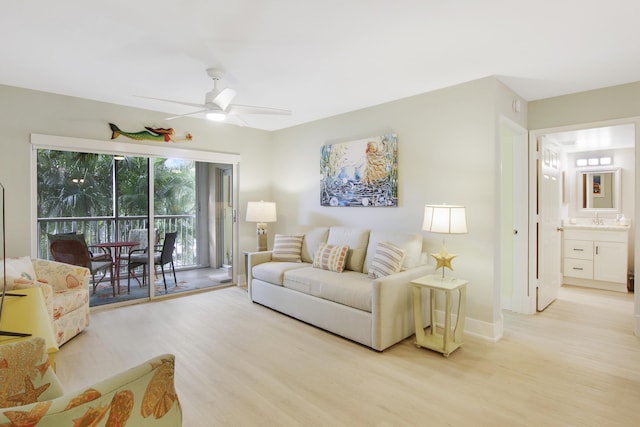 254 Village Blvd Unit 4207, Tequesta, FL 33469 - living area featuring light wood-style floors, a ceiling fan, and baseboards