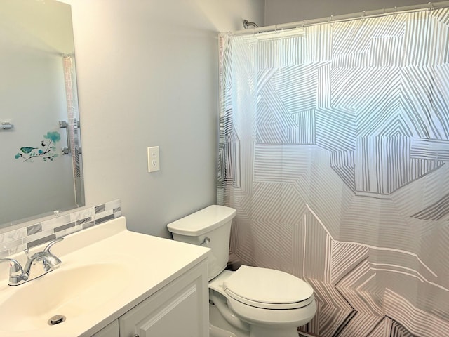 full bathroom with vanity, tasteful backsplash, a shower with curtain, and toilet