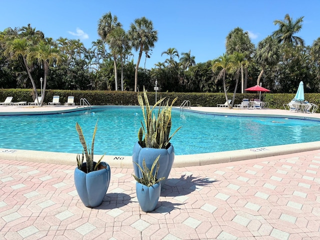 community pool with a patio