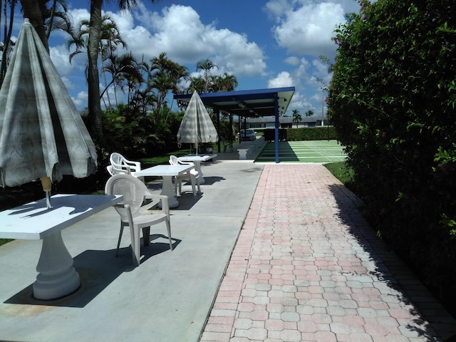 view of home's community featuring shuffleboard