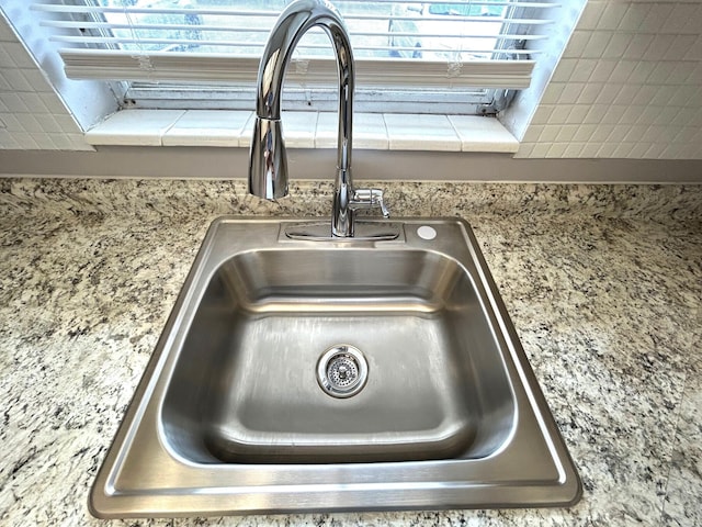 details with a sink and light countertops