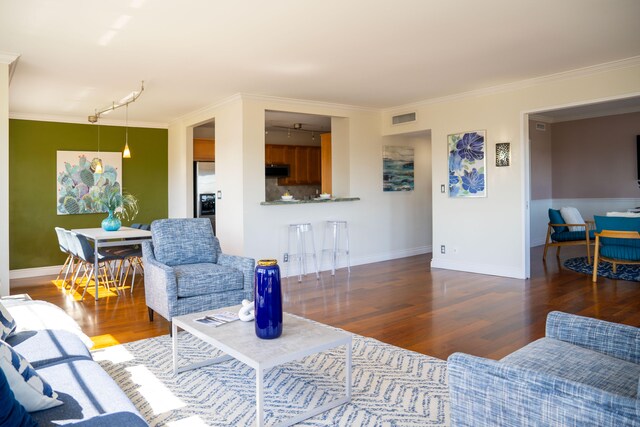 2500 E Las Olas Blvd Unit 802, Fort Lauderdale, FL 33301 - living area featuring wood finished floors, crown molding, baseboards, and rail lighting