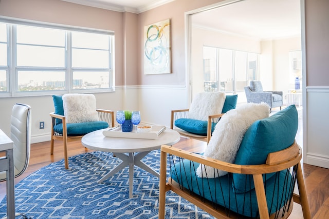2500 E Las Olas Blvd Unit 802, Fort Lauderdale, FL 33301 - living area featuring ornamental molding, wood finished floors, and healthy amount of natural light
