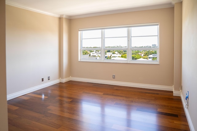 2500 E Las Olas Blvd Unit 802, Fort Lauderdale, FL 33301 - spare room with plenty of natural light, dark wood-style floors, crown molding, and baseboards