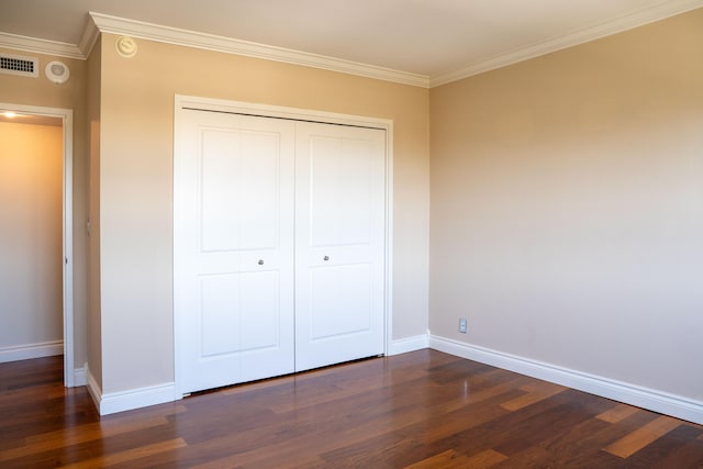 2500 E Las Olas Blvd Unit 802, Fort Lauderdale, FL 33301 - unfurnished bedroom with dark wood-style floors, baseboards, ornamental molding, and a closet