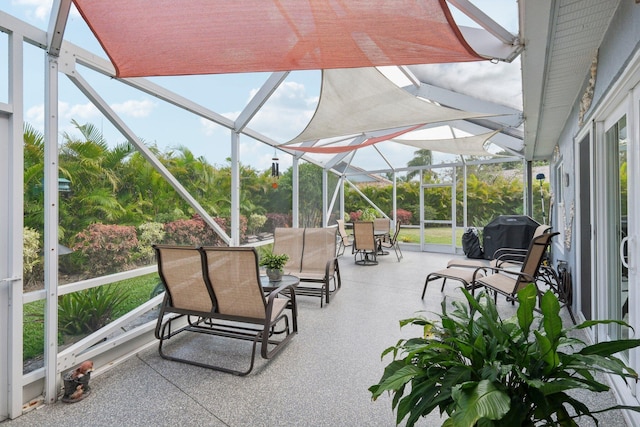 sunroom with outdoor dining area