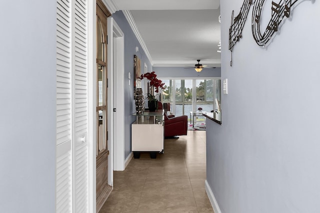 105 NE 19th Ave Unit 164, Deerfield Beach, FL 33441 - hall with a water view, baseboards, ornamental molding, and light tile patterned floors