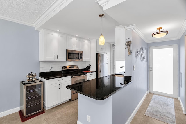 105 NE 19th Ave Unit 164, Deerfield Beach, FL 33441 - kitchen featuring backsplash, dark countertops, appliances with stainless steel finishes, a sink, and beverage cooler