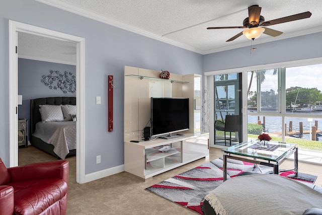 105 NE 19th Ave Unit 164, Deerfield Beach, FL 33441 - living area featuring crown molding, baseboards, a ceiling fan, and a textured ceiling