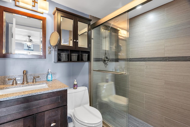 105 NE 19th Ave Unit 164, Deerfield Beach, FL 33441 - bathroom featuring vanity, ceiling fan, toilet, and a shower stall