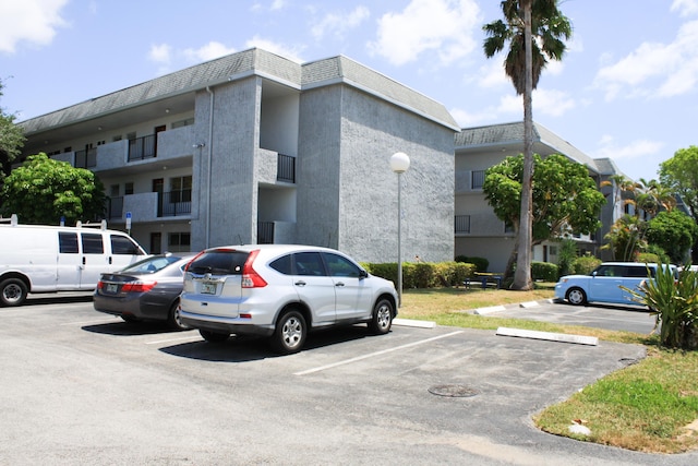 8205 NW 61st St Unit B111, Tamarac, FL 33321 - view of building exterior with uncovered parking