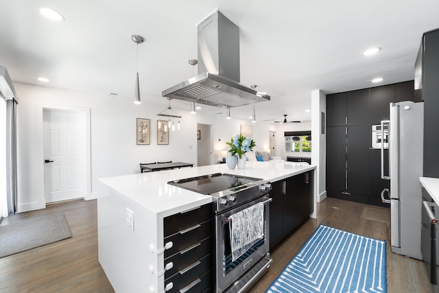 425 32nd St, West Palm Beach, FL 33407 - kitchen with stainless steel electric range oven, island exhaust hood, freestanding refrigerator, light countertops, and recessed lighting