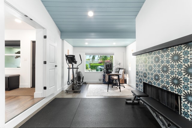 425 32nd St, West Palm Beach, FL 33407 - exercise area featuring baseboards, a fireplace, and recessed lighting