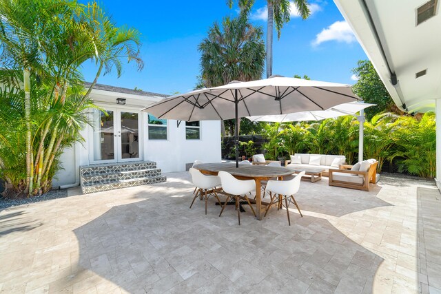 425 32nd St, West Palm Beach, FL 33407 - view of patio / terrace with outdoor lounge area, french doors, and outdoor dining area