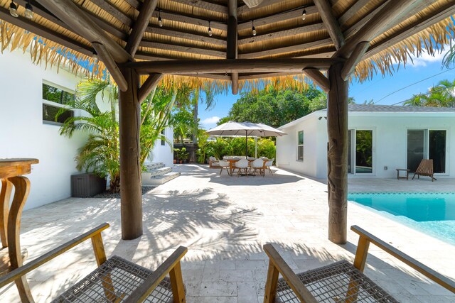 425 32nd St, West Palm Beach, FL 33407 - view of patio / terrace featuring a gazebo, outdoor dining area, and an outdoor pool