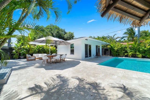 425 32nd St, West Palm Beach, FL 33407 - outdoor pool featuring an outdoor hangout area, a patio, and fence