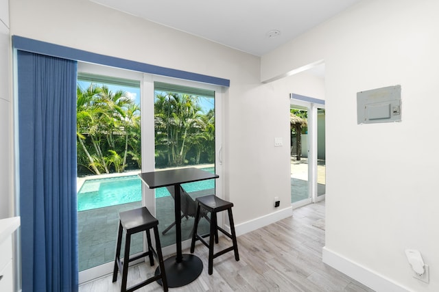 425 32nd St, West Palm Beach, FL 33407 - dining area featuring baseboards and light wood-type flooring