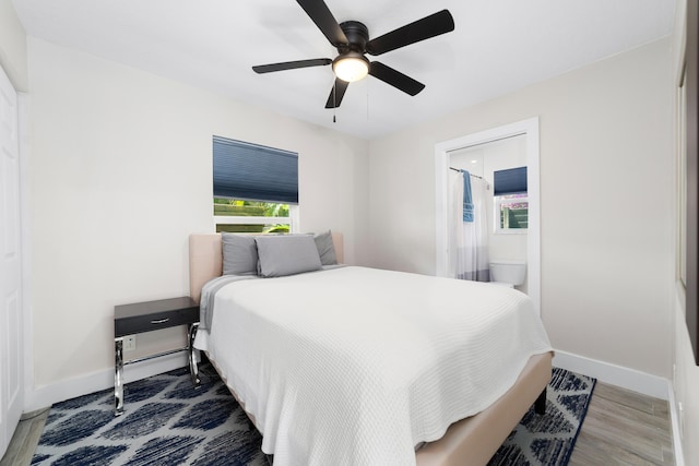 425 32nd St, West Palm Beach, FL 33407 - bedroom featuring baseboards, wood finished floors, and a ceiling fan