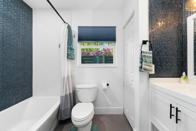 425 32nd St, West Palm Beach, FL 33407 - bathroom with vanity, toilet, shower / bath combo, and baseboards