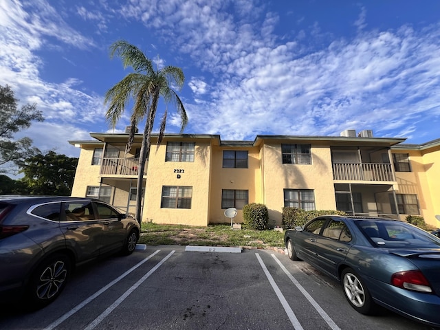 view of property with uncovered parking