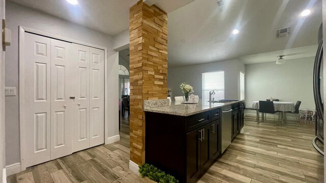 1044 Nin St, Orlando, FL 32835 - kitchen with dishwasher, light wood-style flooring, ornate columns, a sink, and recessed lighting