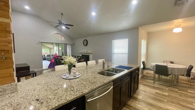 1044 Nin St, Orlando, FL 32835 - kitchen with dishwasher, a sink, ceiling fan, open floor plan, and light wood finished floors