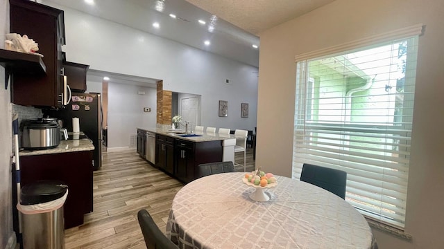 1044 Nin St, Orlando, FL 32835 - dining area with light wood-style flooring