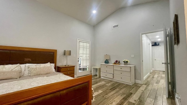 1044 Nin St, Orlando, FL 32835 - bedroom featuring high vaulted ceiling, light wood-style flooring, and baseboards