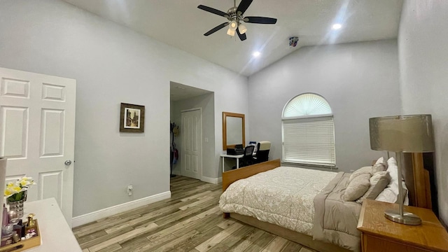 1044 Nin St, Orlando, FL 32835 - bedroom featuring light wood finished floors, high vaulted ceiling, baseboards, ceiling fan, and a closet