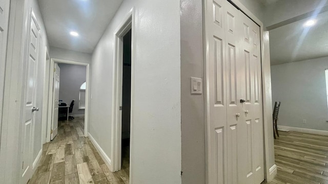 1044 Nin St, Orlando, FL 32835 - hallway featuring light wood finished floors and baseboards