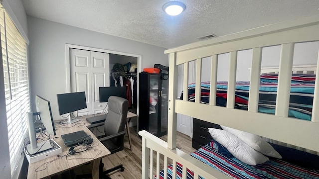 1044 Nin St, Orlando, FL 32835 - office featuring a textured ceiling and wood finished floors