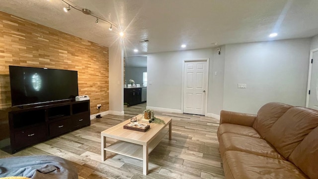 1044 Nin St, Orlando, FL 32835 - living room with light wood-style flooring, baseboards, recessed lighting, and track lighting