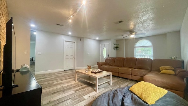 1044 Nin St, Orlando, FL 32835 - living area featuring light wood-style floors, a ceiling fan, recessed lighting, a textured ceiling, and baseboards