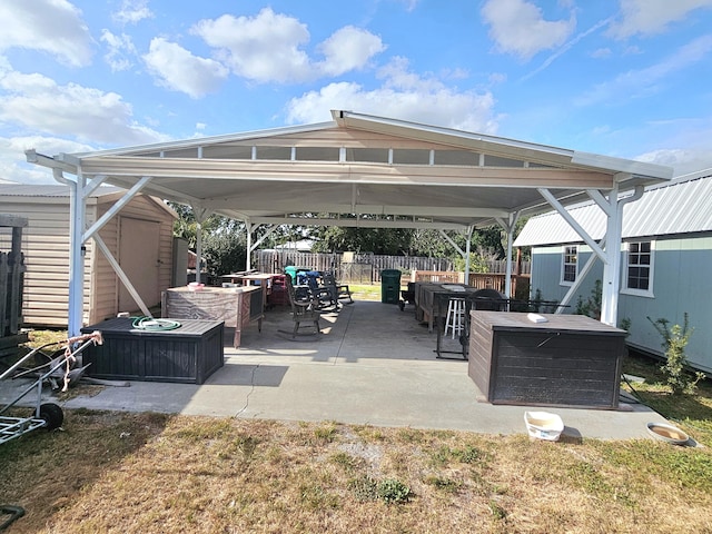 17120 NW 38th Ave, Okeechobee, FL 34972 - view of patio / terrace with fence, a storage shed, a gazebo, and an outbuilding