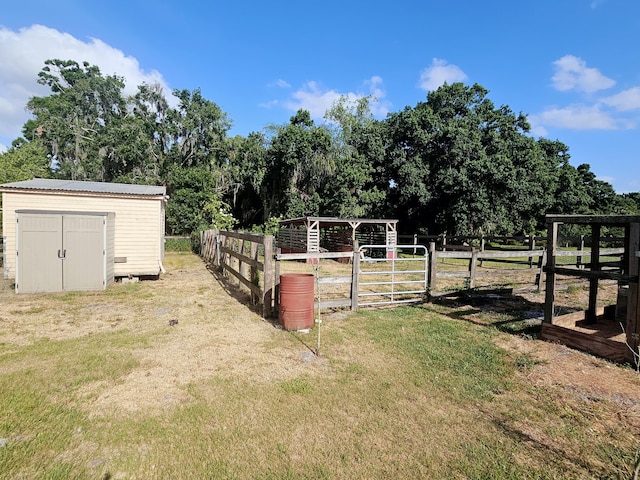 17120 NW 38th Ave, Okeechobee, FL 34972 - view of yard featuring fence, a shed, and an outbuilding