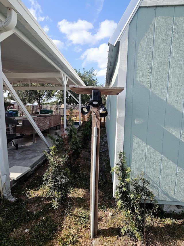17120 NW 38th Ave, Okeechobee, FL 34972 - view of property exterior featuring fence and a patio area