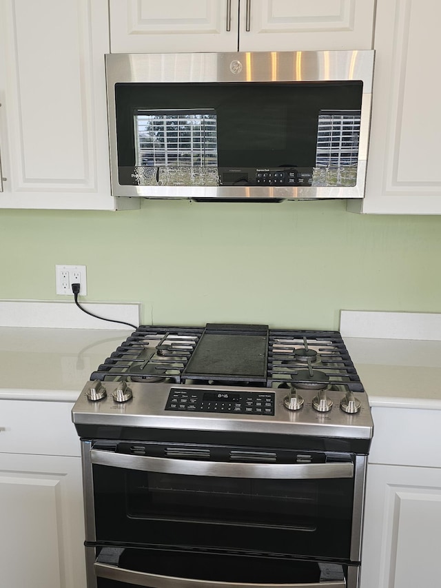17120 NW 38th Ave, Okeechobee, FL 34972 - interior details with white cabinetry and appliances with stainless steel finishes