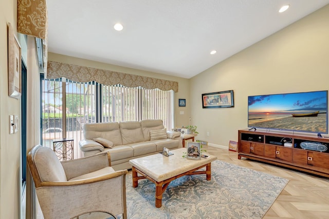 living area featuring baseboards, vaulted ceiling, and recessed lighting