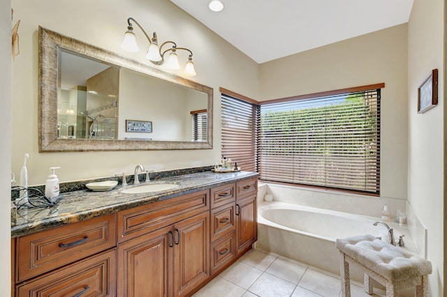 full bathroom with tile patterned floors, tiled shower, vanity, and a garden tub